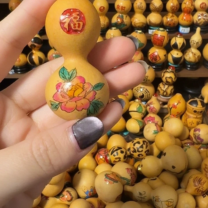 绿***业陶瓷葫芦绕指手把件