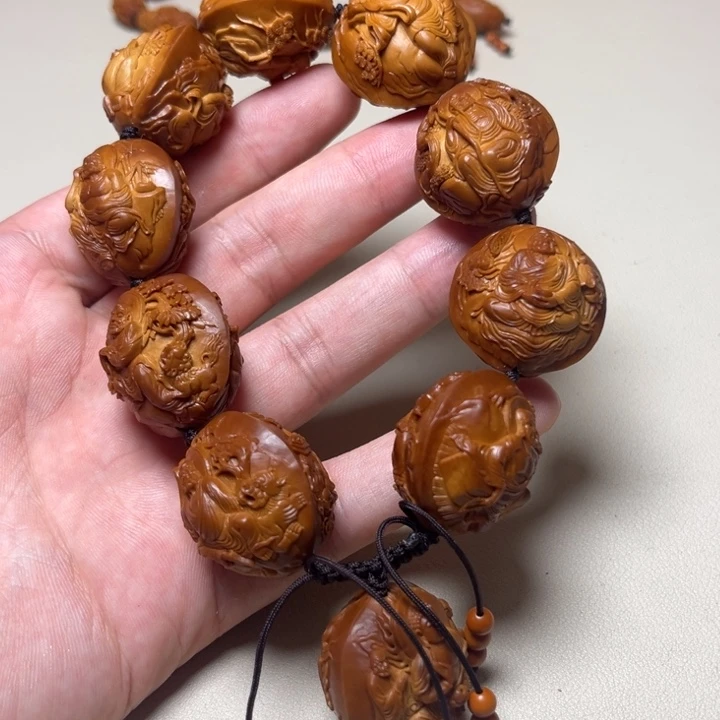 曾***牛橄榄核手串十八罗汉