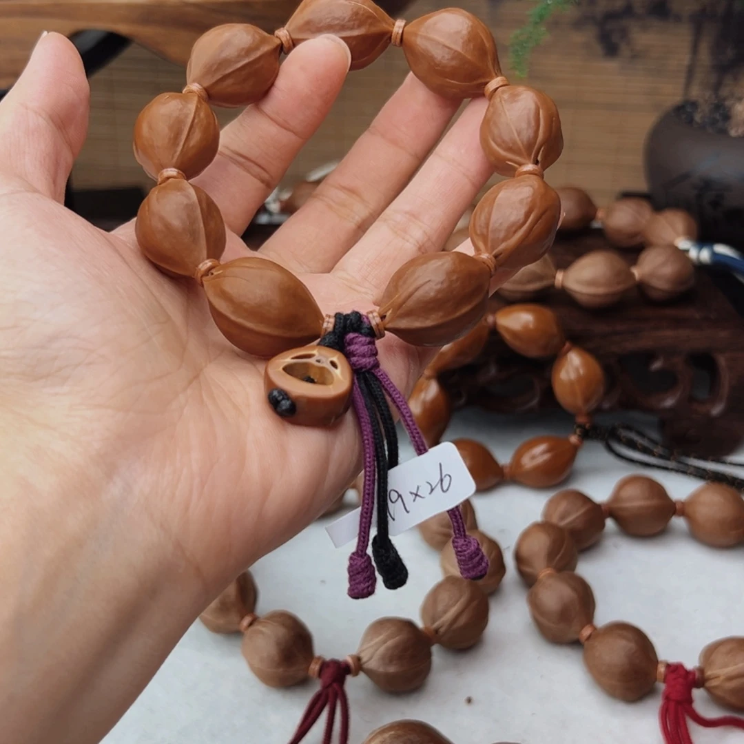 晓***雨橄榄核手串19*26三花核串