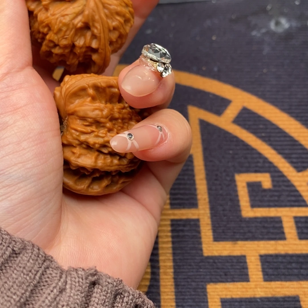 豫***牙文玩核桃把件白狮子