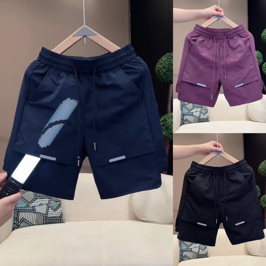 夏季新款激光打孔透气休闲运动短裤男士时尚拼接薄款速干五分裤