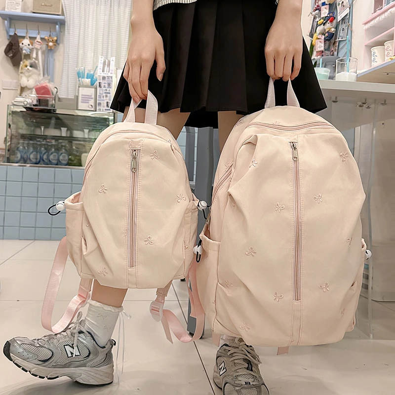 书包初中女生大容量少女心蝴蝶结高颜值大学生游玩通勤双肩包背包