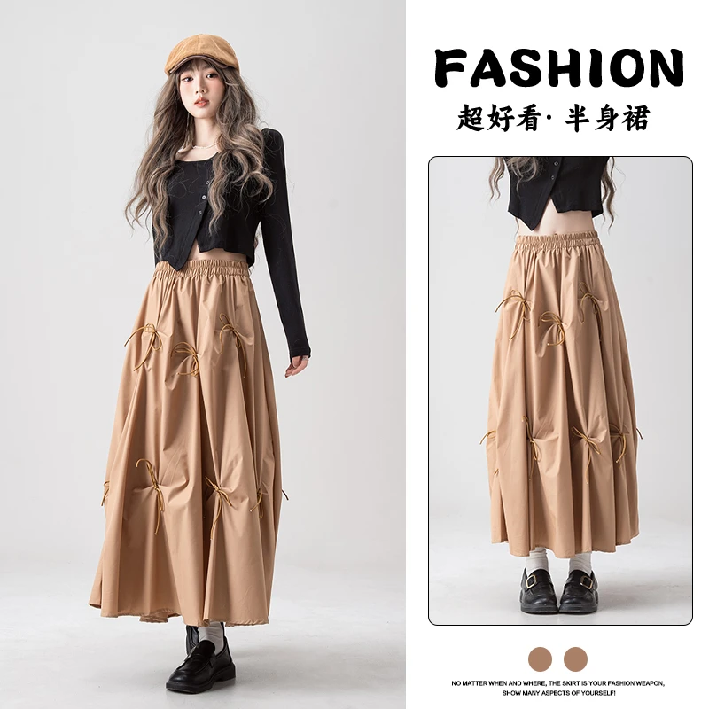 Nurtureone卡其色立体蝴蝶结半身裙春季新款女装高腰中长款a字裙