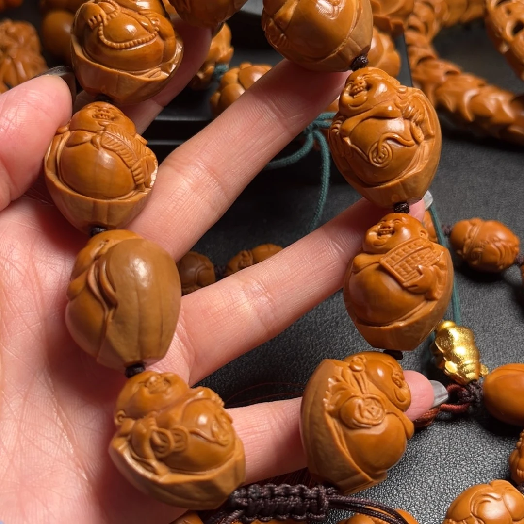 张***明吊坠橄榄核米勒22