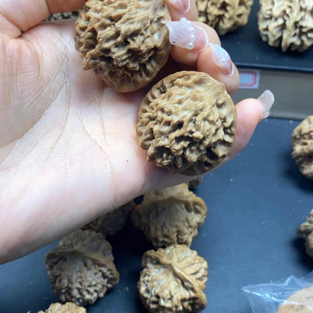 桃核把件胖***^秦闷瑕疵35