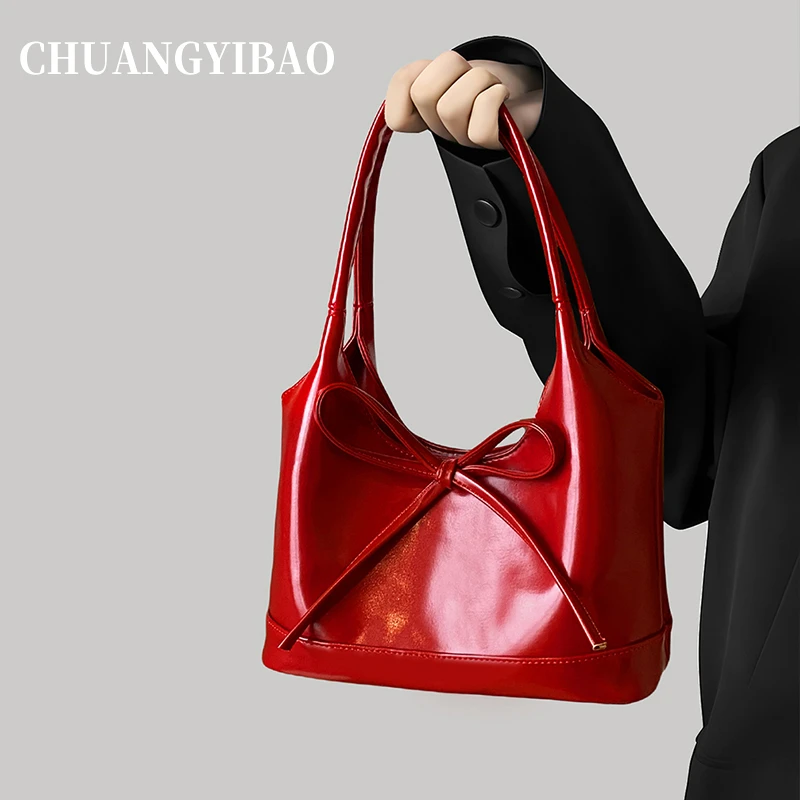 红色超火手提托特包包女式2025新款高级感轻奢小众单肩婚包女新娘