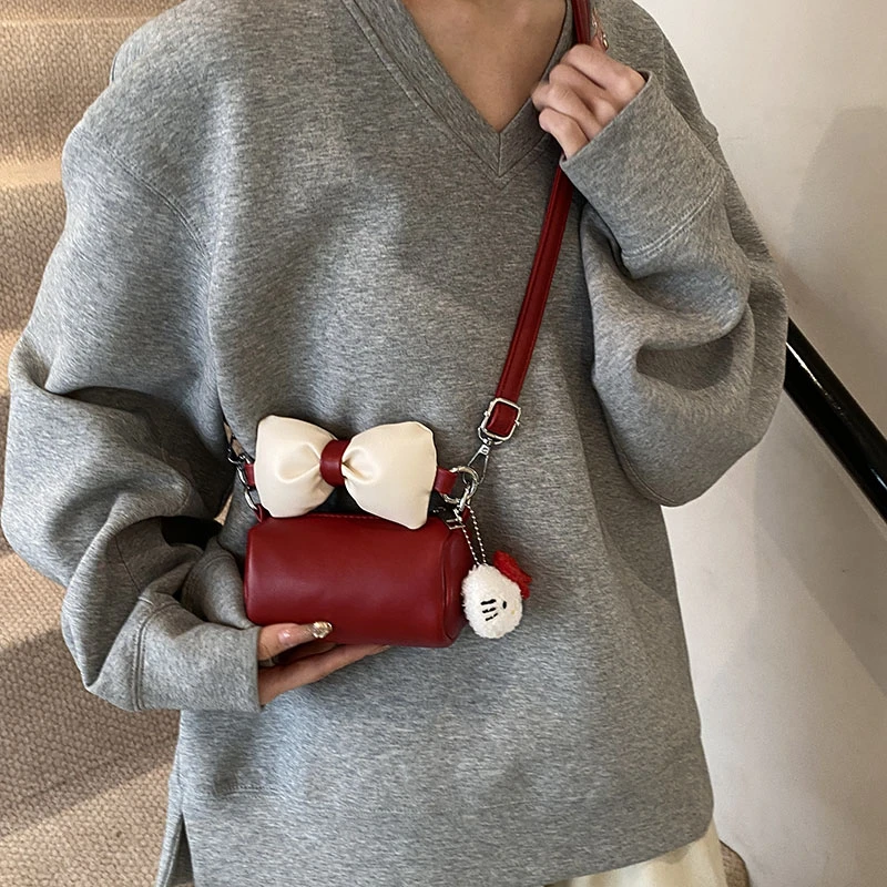 韩版可爱蝴蝶结女童迷你斜挎包卡通百搭撞色洋气公主零钱手拎包包