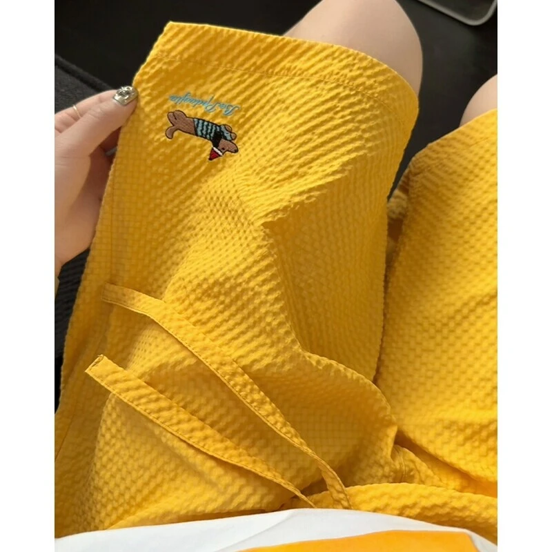 橘黄色泡泡纱短裤男款夏季潮牌冰丝速干五分裤美式运动休闲沙滩裤