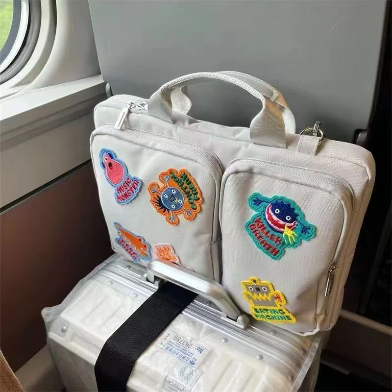 小众设计怪物贴布笔记本电脑包斜跨16英寸女电脑文件手提收纳包yj