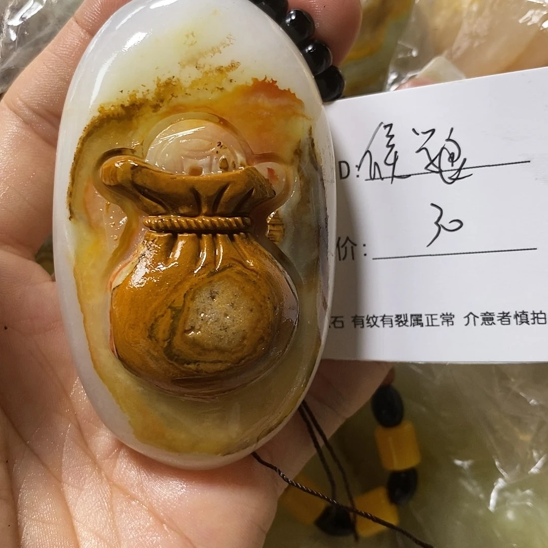 石材侯*良古青石手把件