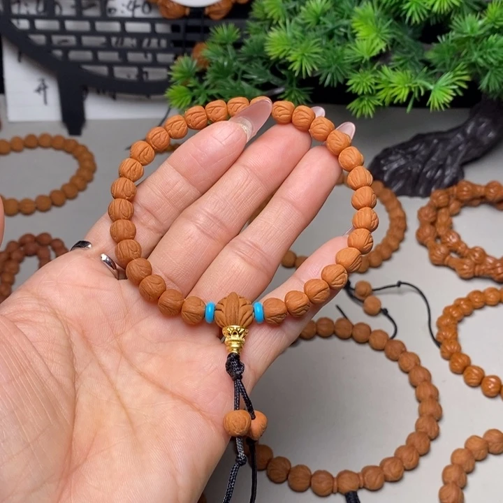 辉***生桃核手串玉龙脊手持