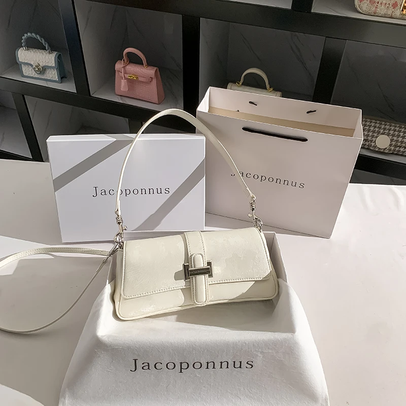 雅各邦真皮白色月牙腋下包女2025新款法式设计夏季单肩斜挎法棍包