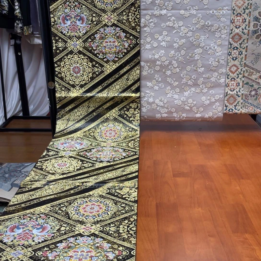 织绣黑金凤凰宝相