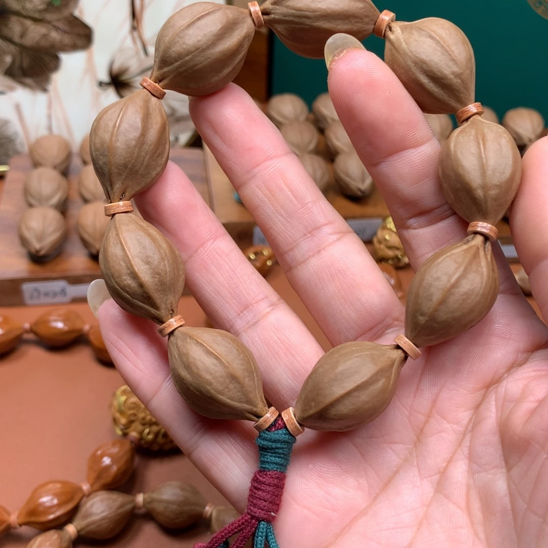 马***白橄榄核手串梅林四花核