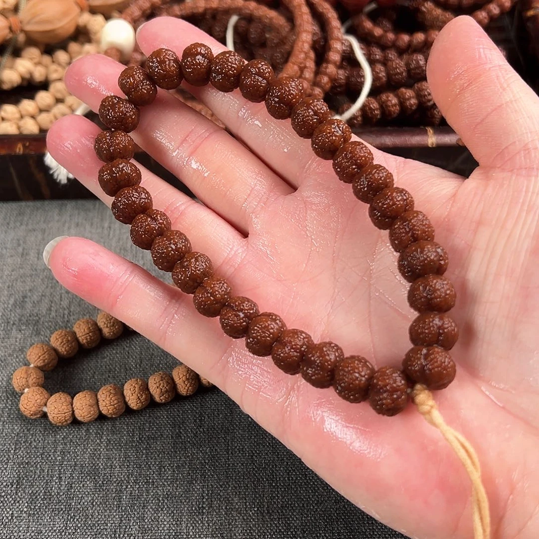 猴头核桃吊坠四瓣龙鳞王手持