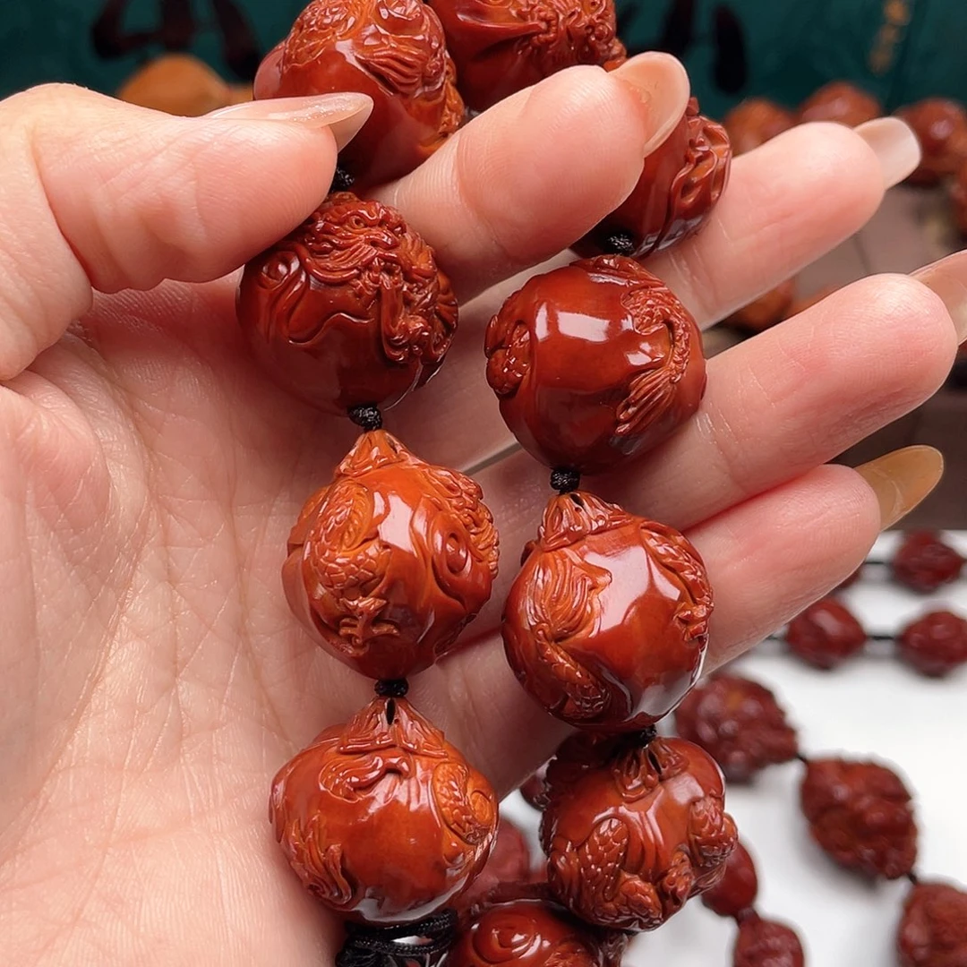 橄榄核手串从**求九龙手串