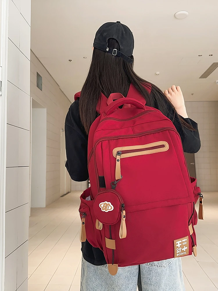 减负护脊双肩包女2025新款大容量初高中大学生书包男生旅游背 包