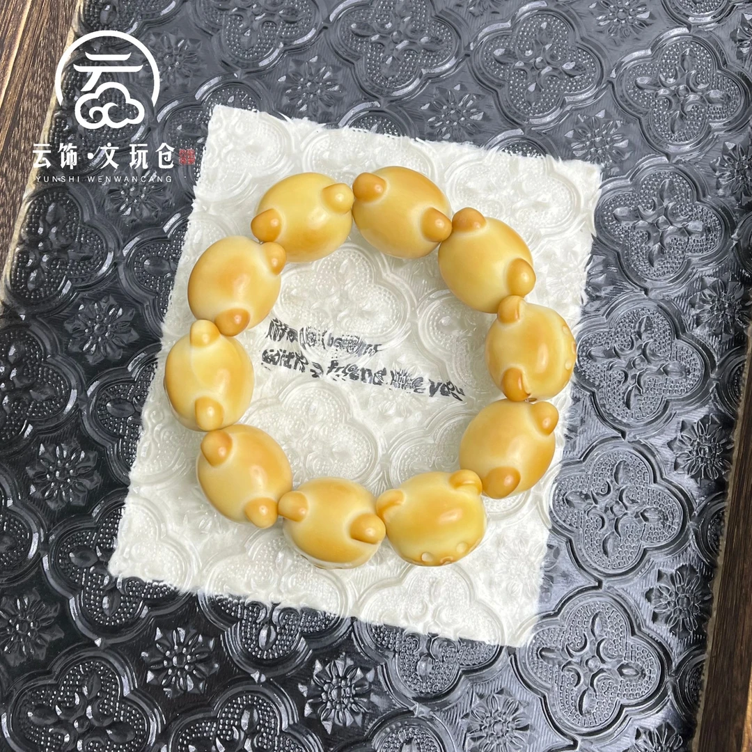 钏纳22-25mm    象牙果炭烤竖孔表情熊单圈     CS111-2414