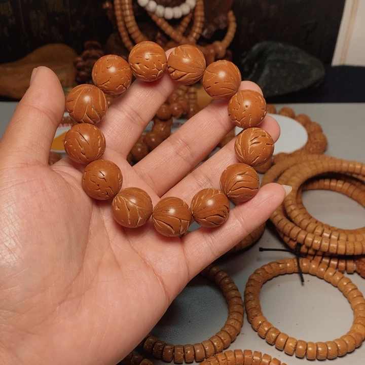 桃核吊坠河**人桃核手串