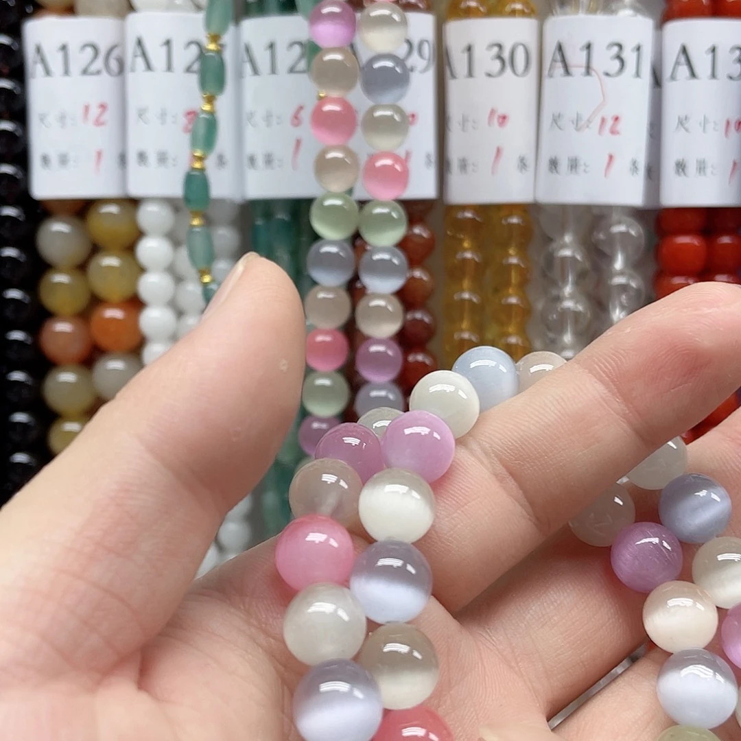 伊***妈玛瑙/玉髓合金珠宝半成品猫眼10mm一条