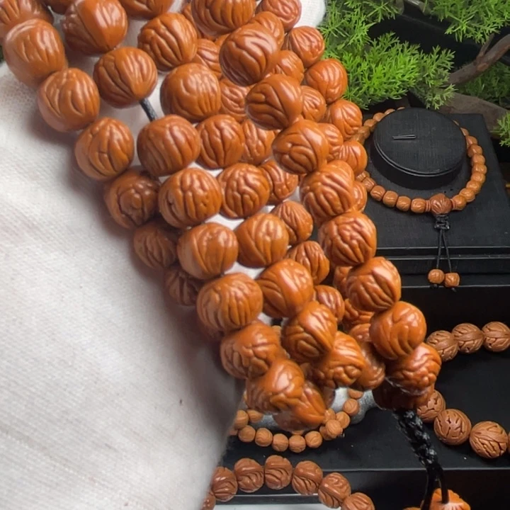 伊***草桃核吊坠精品脖挂