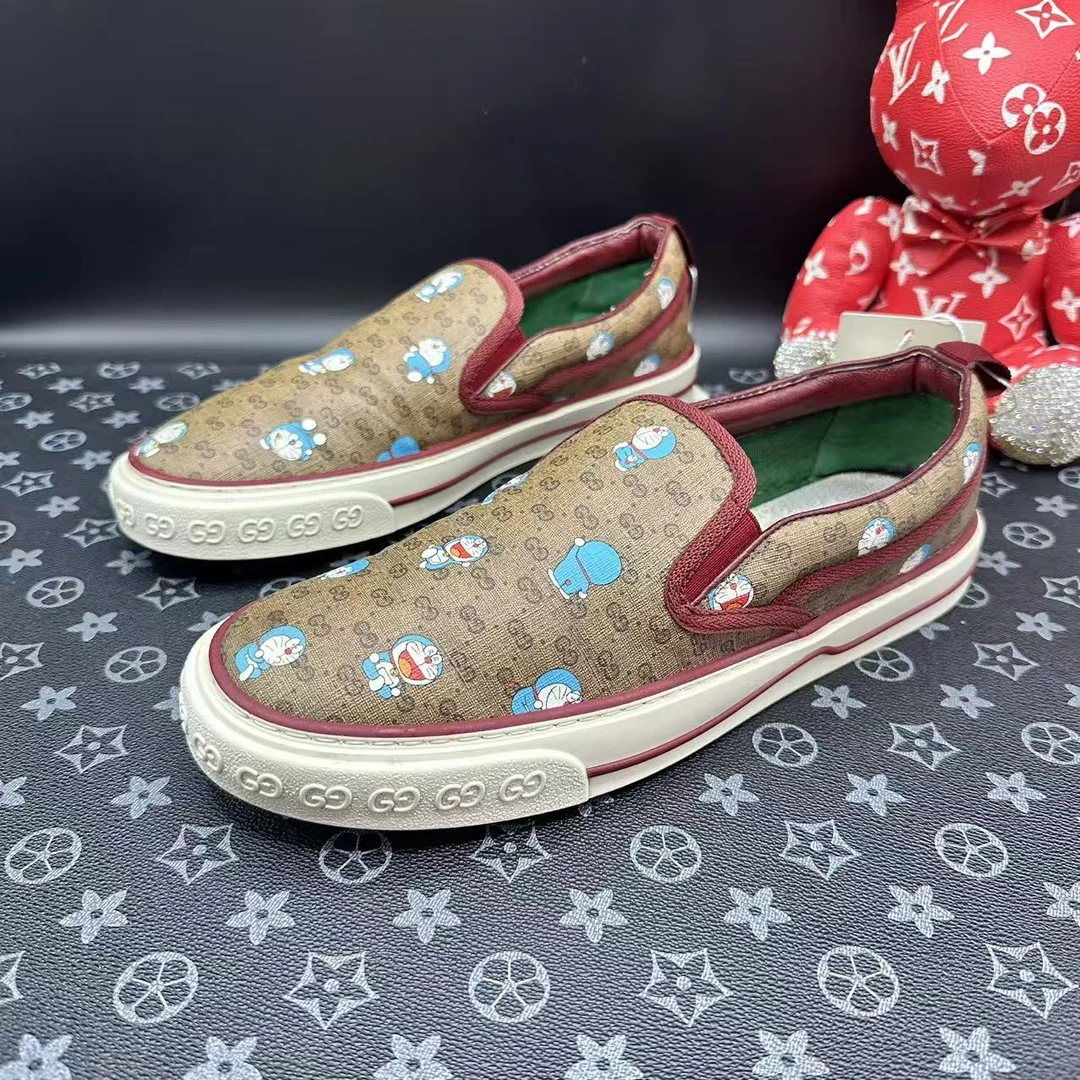 95新 GUCCI/古驰 哆啦A梦联名乌木色双G一脚蹬41欧码 ddm3038