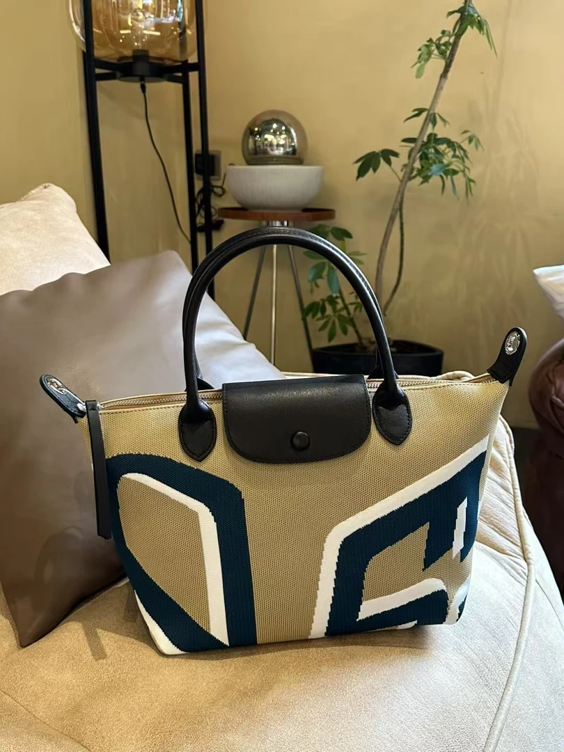 『XIGE STUDIO』春夏新品梭织印花饺子斜挎包