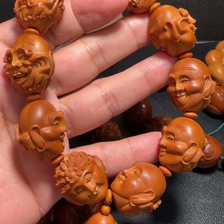 么***赫橄榄核把件殷派罗汉