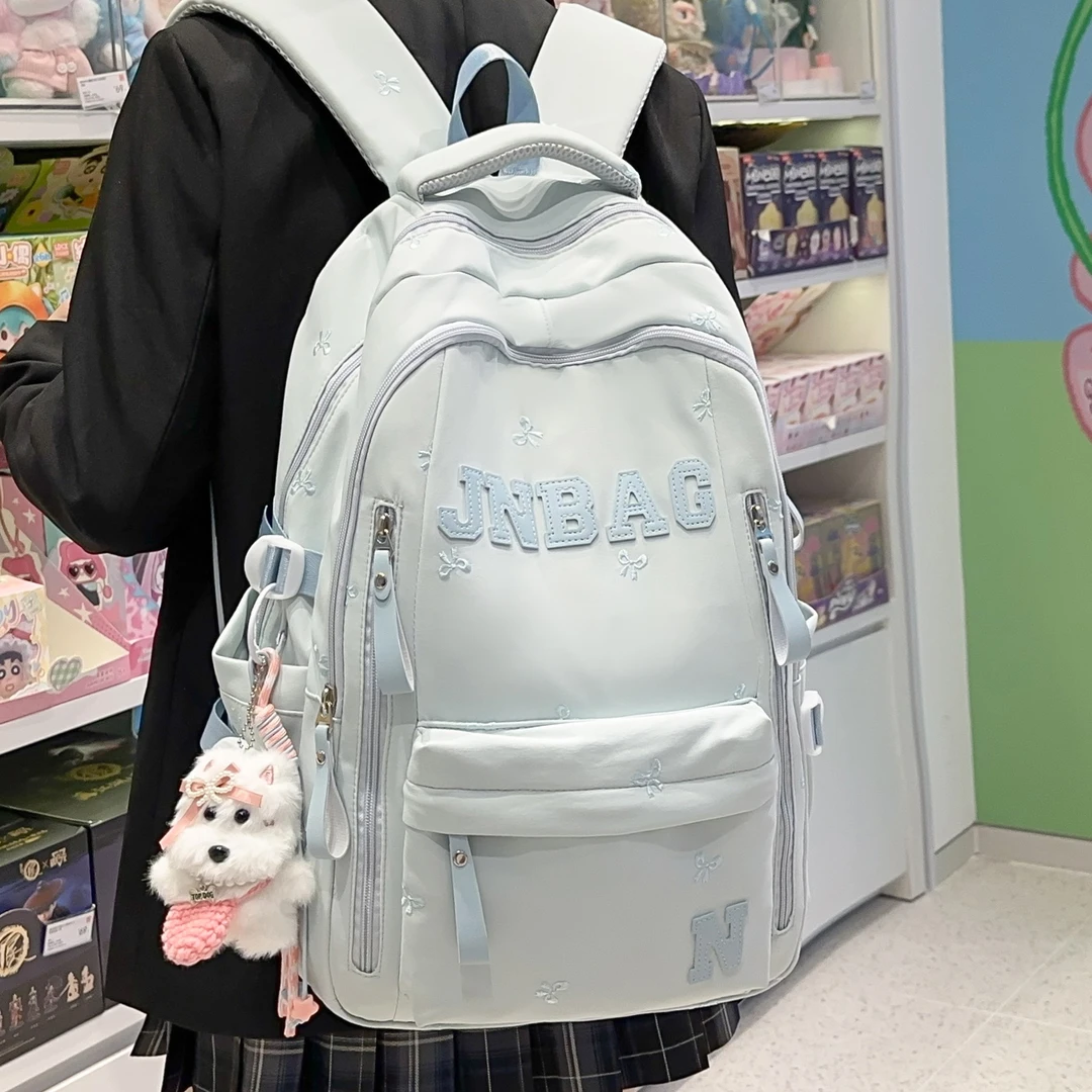 学院风书包女纯色蝴蝶结刺绣字母双肩包初中高中大学生上课背包