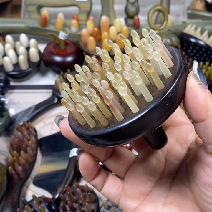 紫光檀64齿羊角按摩梳微瑕疵