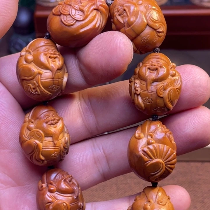 兰***店橄榄核手串/手链反油财神