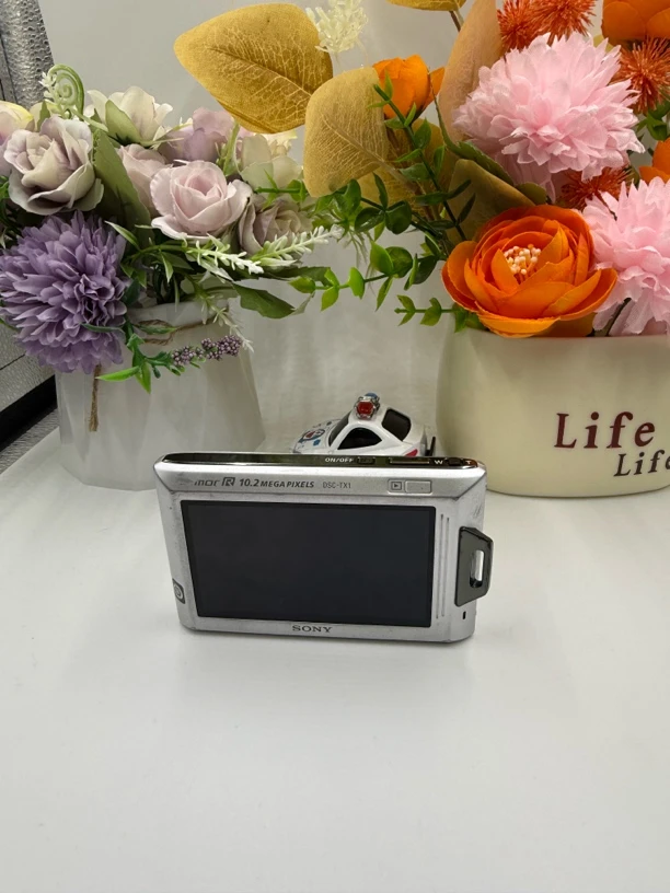 95新  Sony/索尼 TX1 银色1020万像素 4倍变焦 拍照复古胶片感