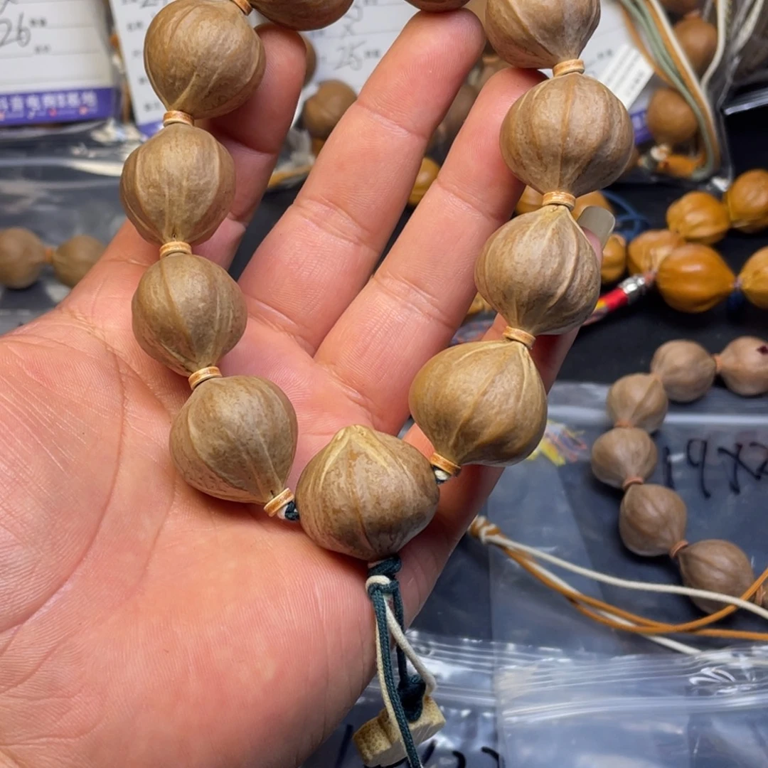 明***口手串橄榄核正四花25x25mm