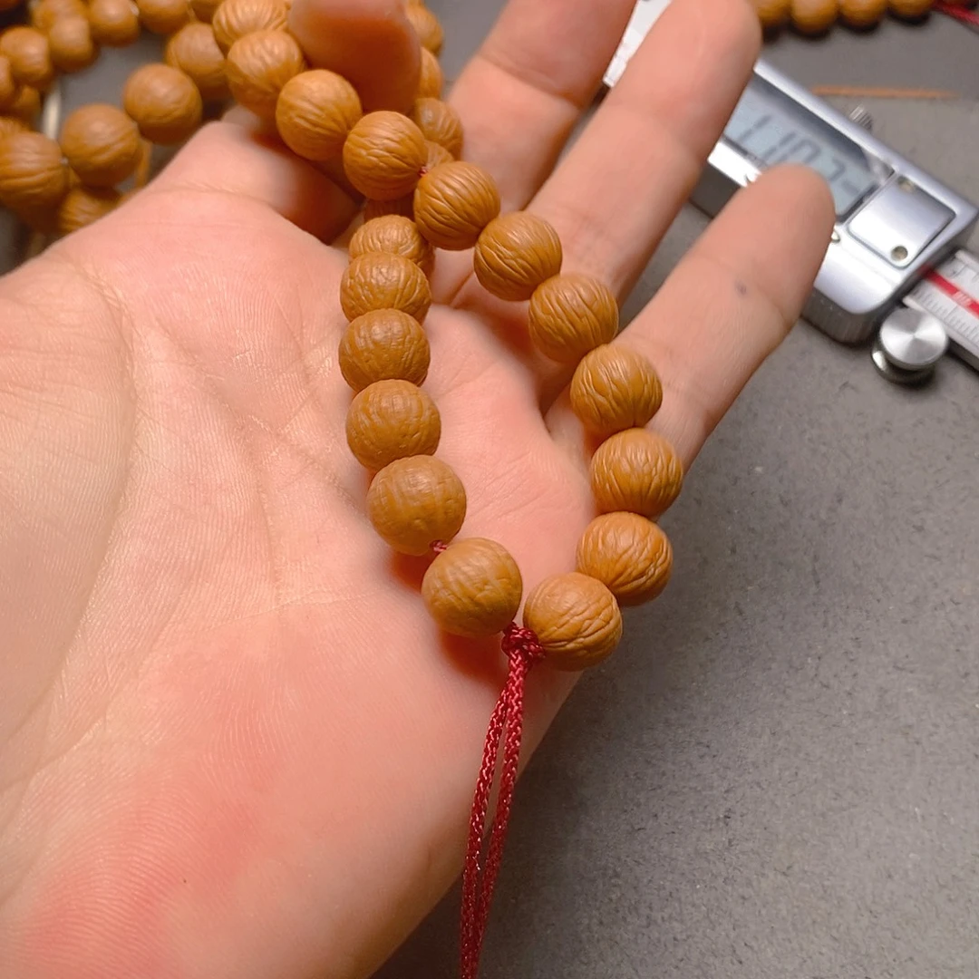 肆***.吊坠猴头核桃凤羽