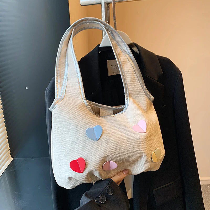 小众通勤托特包包女2024新款潮夏天单肩包时尚甜美少女桃心腋下包