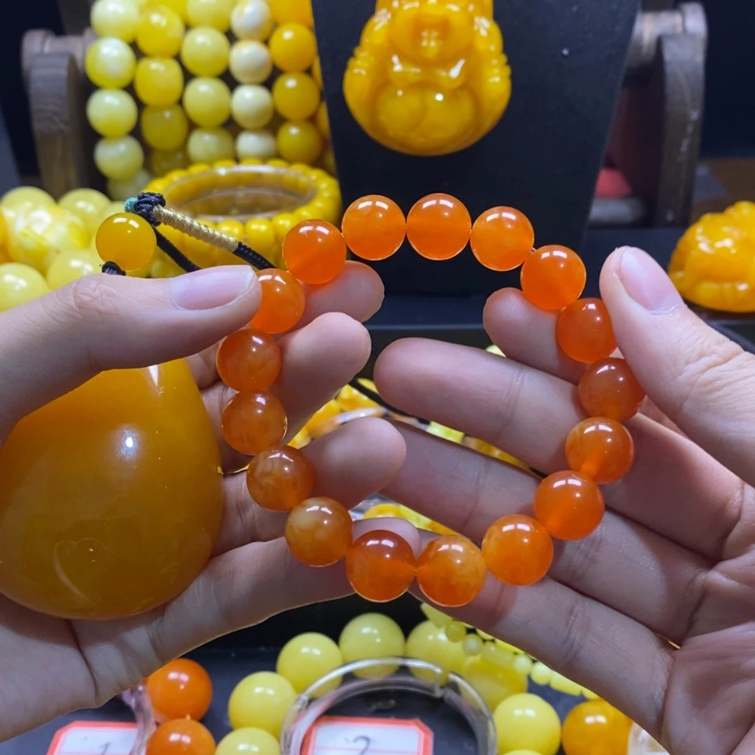 莉***雅非金属卡12蜜橘红手串