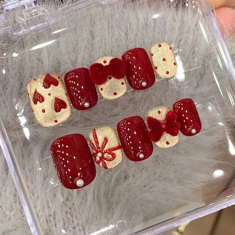 红色波点蝴蝶结猫眼手工穿戴甲新年可爱显白美甲