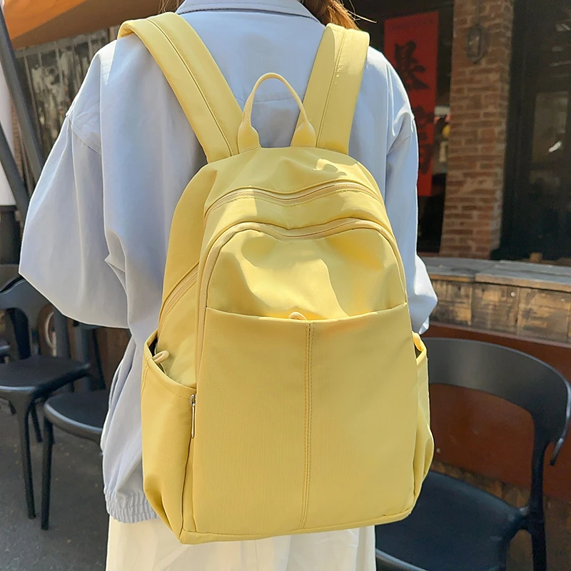 日系大学生双肩包旅游轻便大容量纯色背包上班通勤初高中书包双层