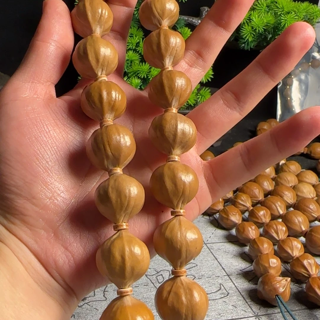 旋***马橄榄核2.1四花持精品