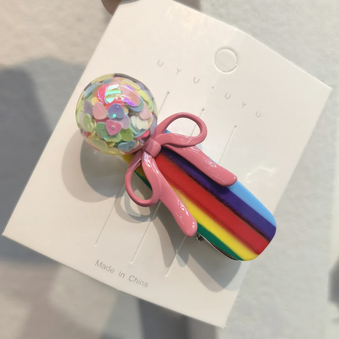 E130彩虹色爱心球蝴蝶结边夹