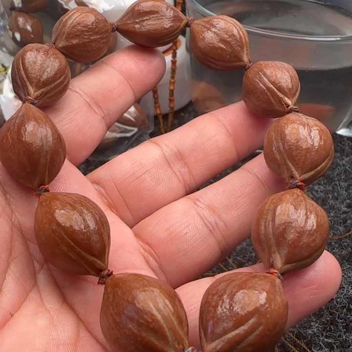 橄榄核手串橄榄核原皮铁盒三面佛