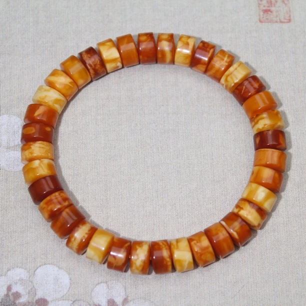 天然原矿老蜜蜡妖花多宝药片手串9mm