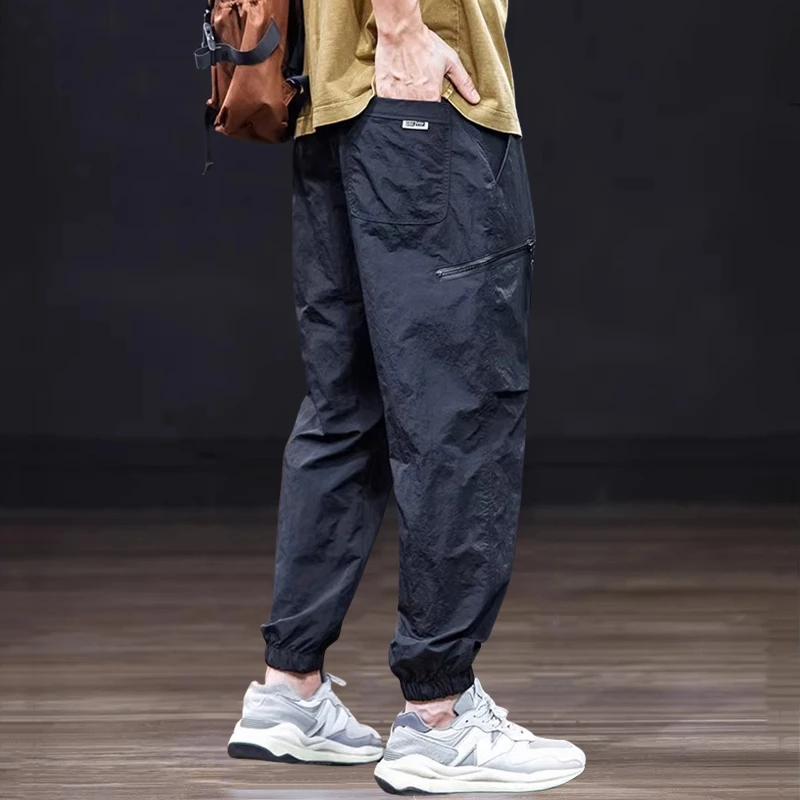 夏季薄款休闲裤男士潮牌速干运动束脚裤宽松大码工装伞兵美式裤子