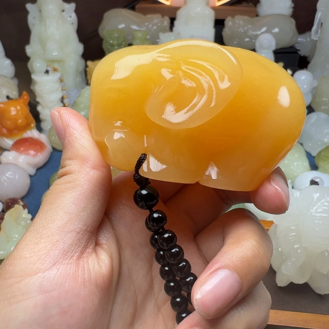 石材吾**君黄糖色手把大象