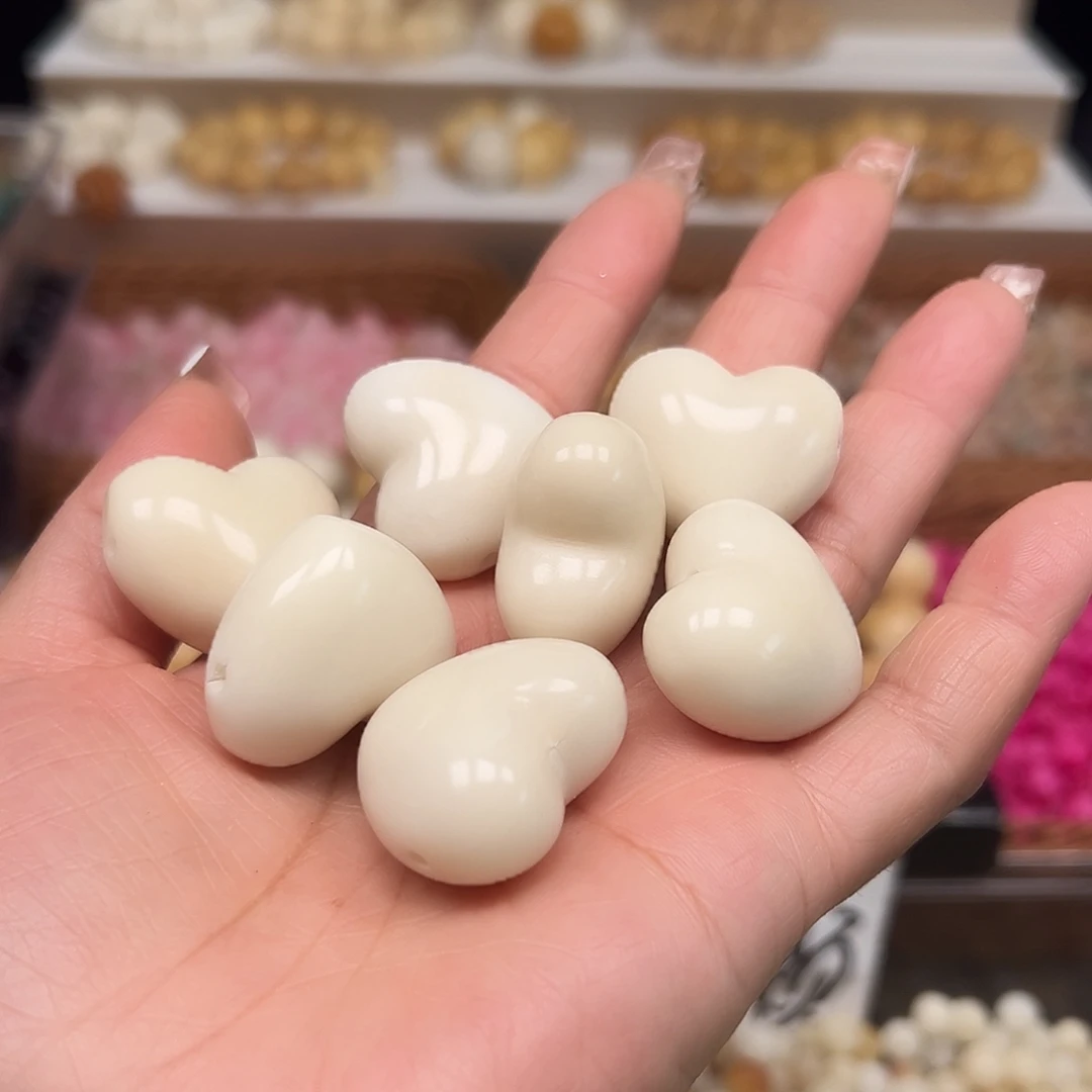 菩提根/象牙果手串瑕疵卡29左右白色爱心7颗孔道有裂