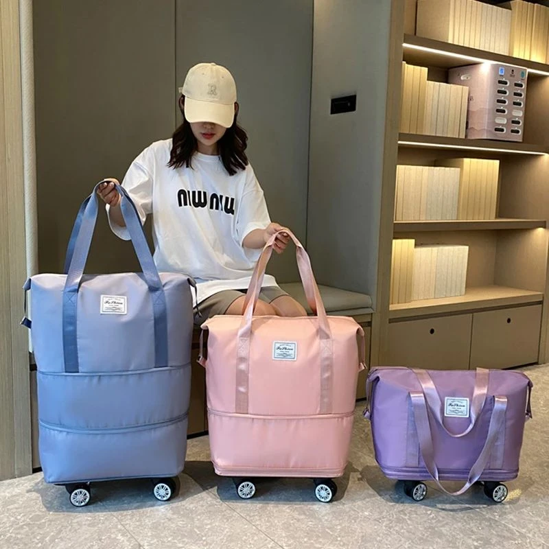 旅行包大容量万向轮学生出差待产收纳包防水分离可扩张行李袋