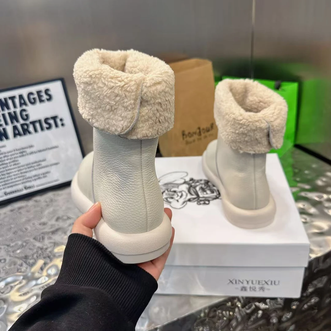 冬季靴子流苏舒适胶粘铆钉平跟保暖女鞋马丁靴厚底加绒加厚百搭