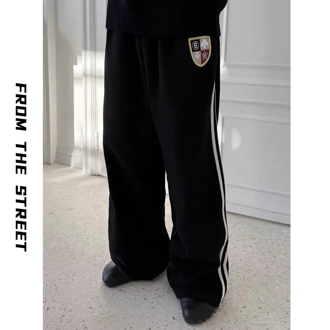 来自街头复古洗水破坏慵懒休闲运动刺绣徽章宽松baggy针织卫裤男