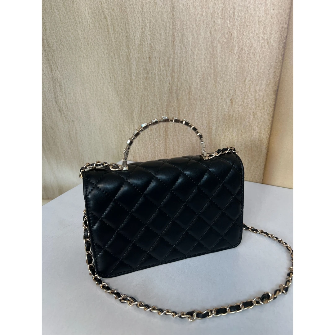 TOLEX2025新款时尚百搭卧手拎斜跨女包黑色钻手柄