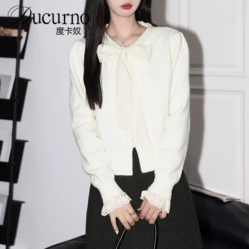 法式气质蕾丝系带针织开衫女2026年冬季新款软糯杏色宽松长袖上衣